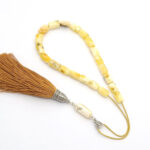 Yellow matt amber kompoloi with silver fittings and silk