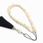 Painted animal bone kompoloi with Silver and silk