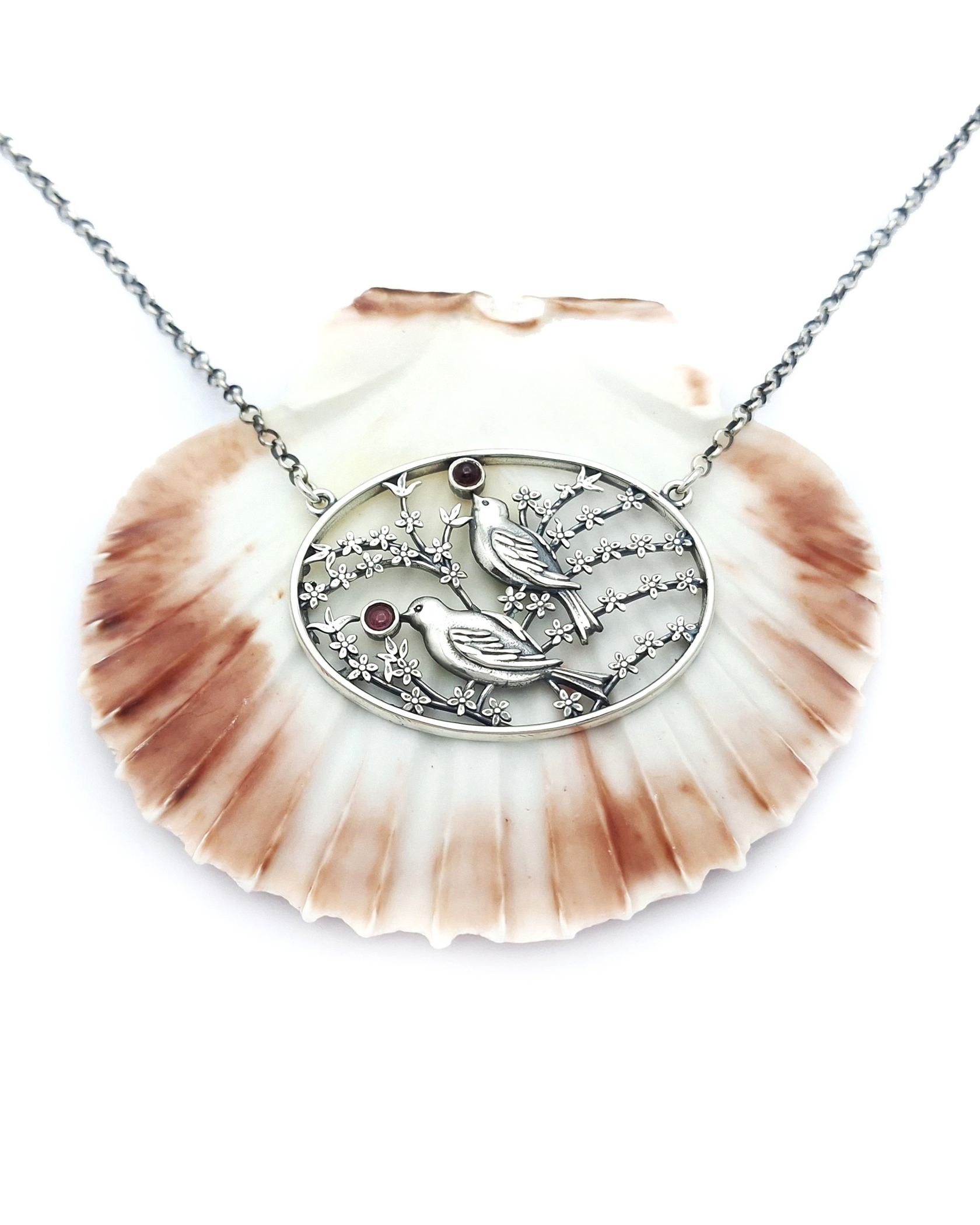 Handmade silver pendant with birds and flowers