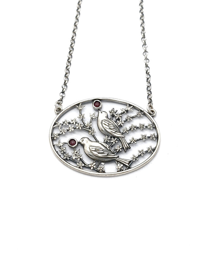 Handmade silver pendant with birds and flowers
