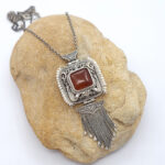 Handmade silver pendant with birds and flowers
