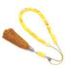 Yellow matt amber kompoloi with silver fittings and silk