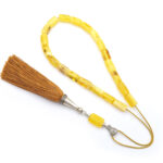 Yellow matt amber kompoloi with silver fittings and silk