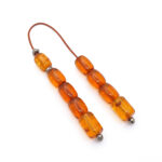 Begleri made of genuine Baltic amber in cognac color and 925 silver