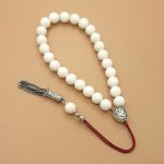 Komboloi Made of Camel Bone with Silk Tassel and Emblem